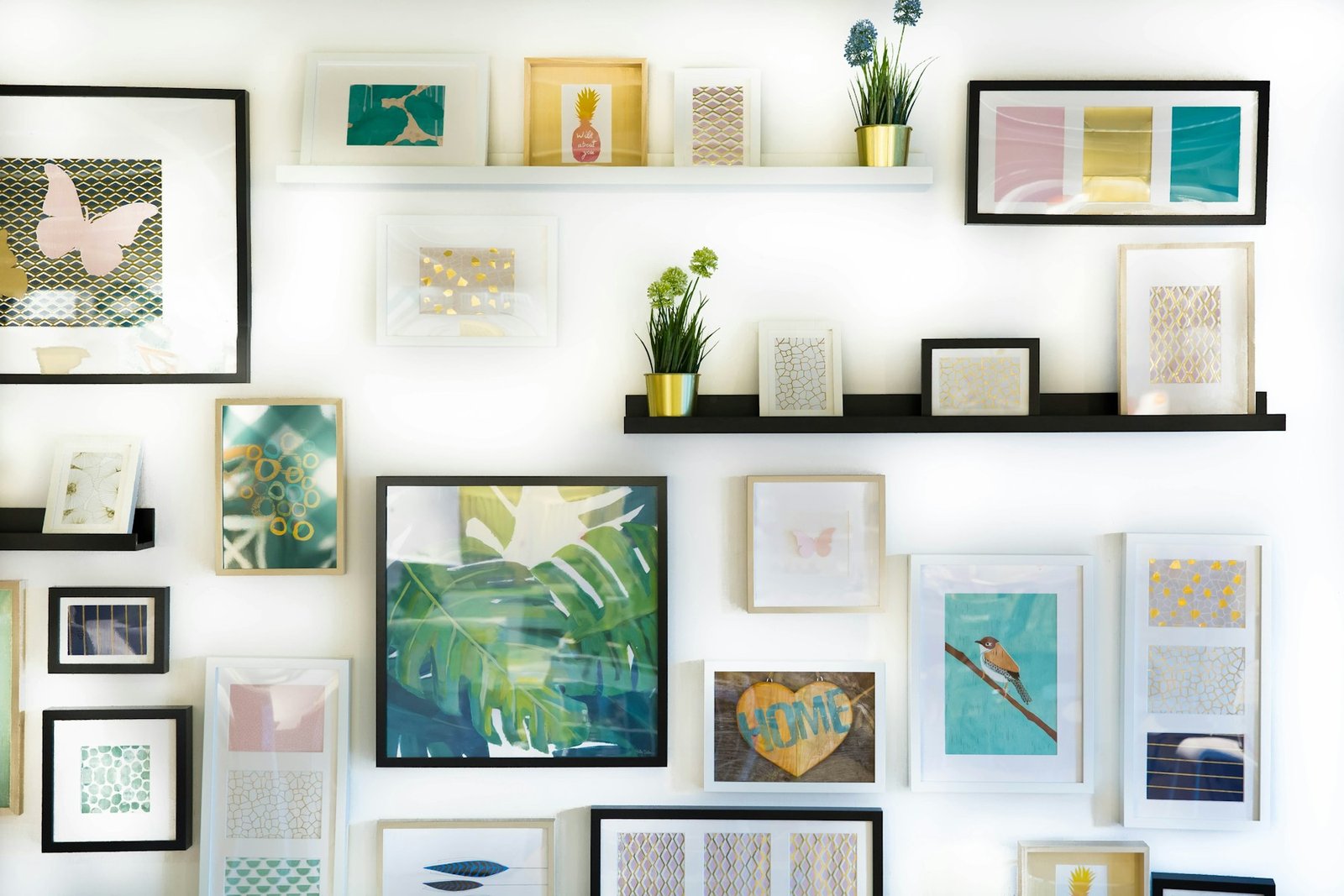 Framed printable wall art arranged above a warm interior console