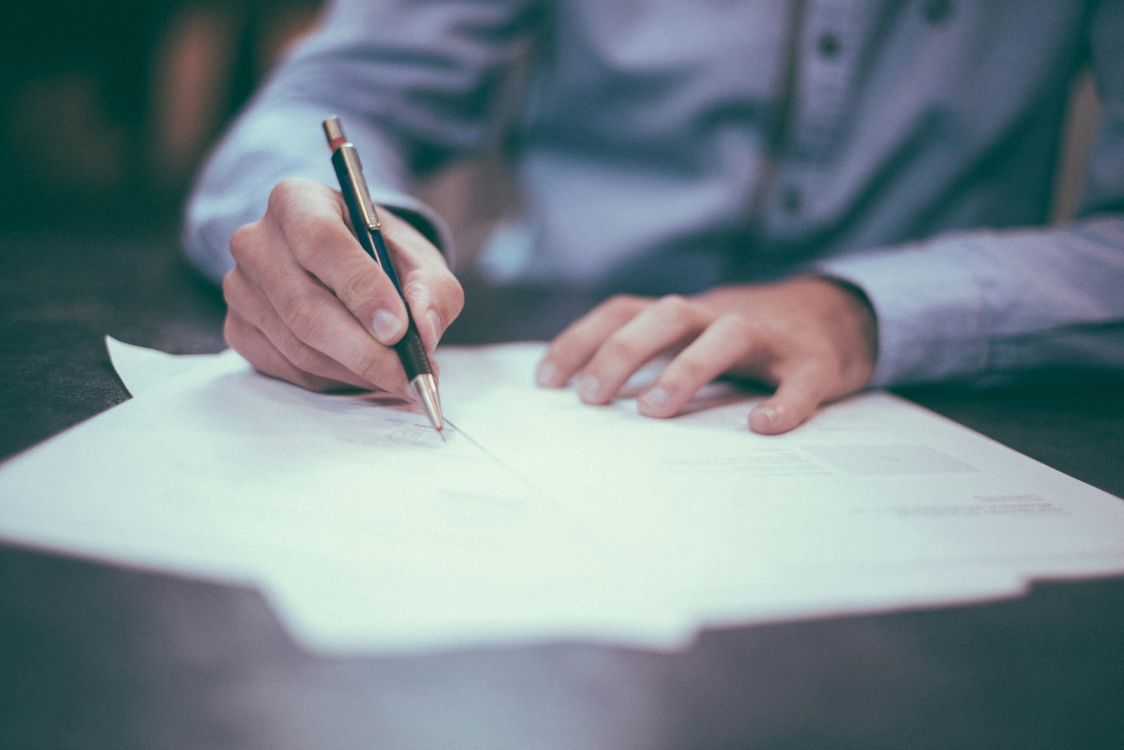 Documents and a pen arranged on a clean desk for privacy information